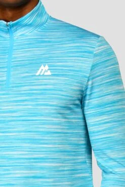 Trail 2.0 1/4 Zip - Neon Blue/White 11 Trail 2.0 1/4 Zip - Neon Blue/White -Montirex TRAIL 1 4 ZIP BLUEFISH ATOMIC BLUE WHITE logo detail